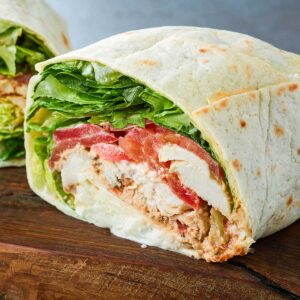 closeup of a chicken wrap with veggies