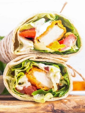 two chicken nugget wraps on a cutting board