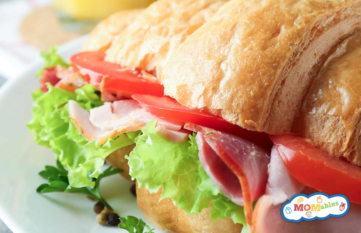 ham, tomato and lettuce croissant sandwich