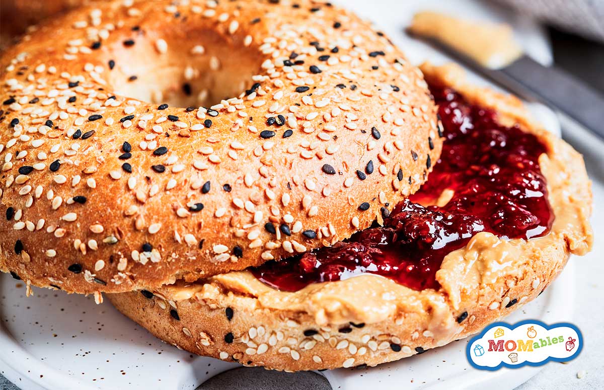peanut butter and jelly bagel sandwich on a plate