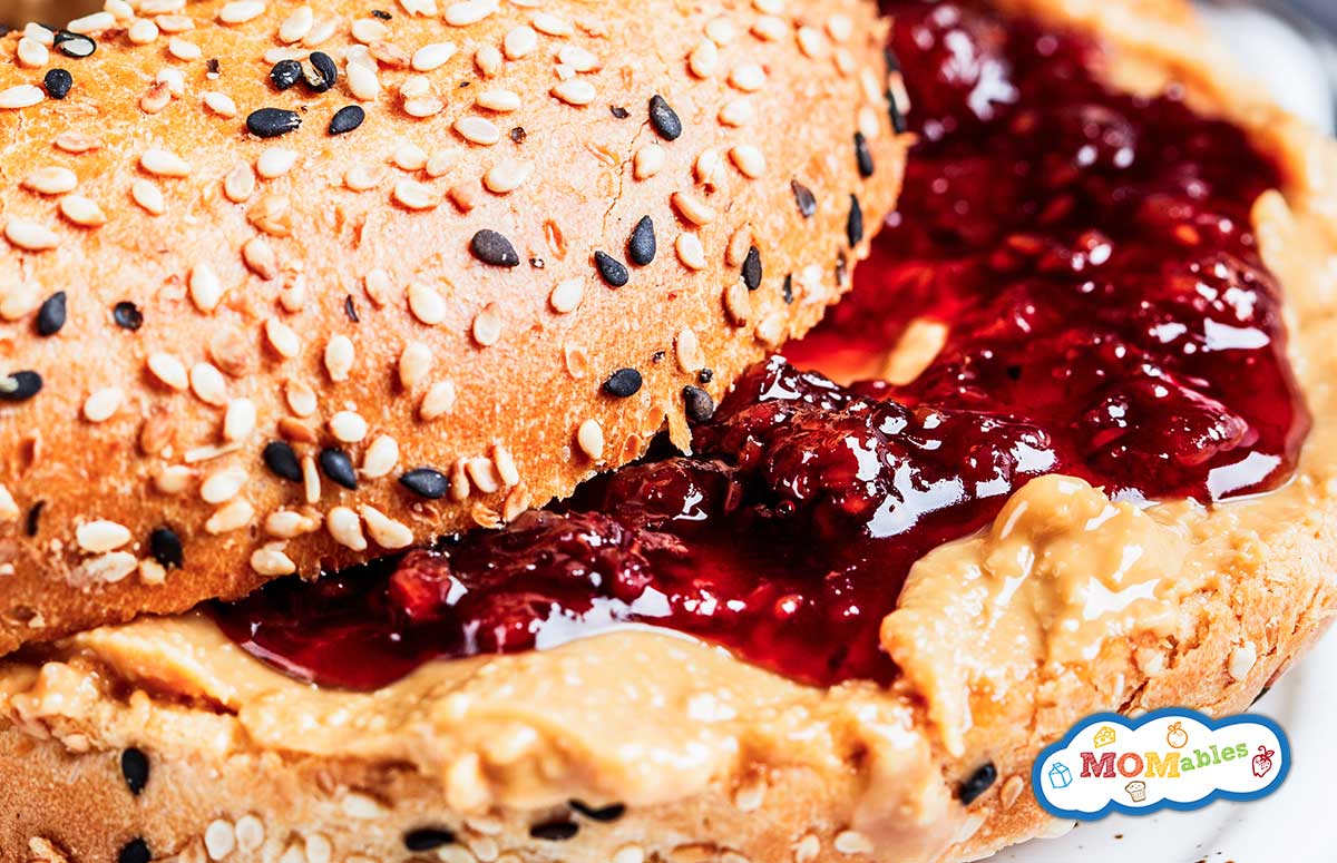 closeup of a peanut butter and jelly bagel sandwich