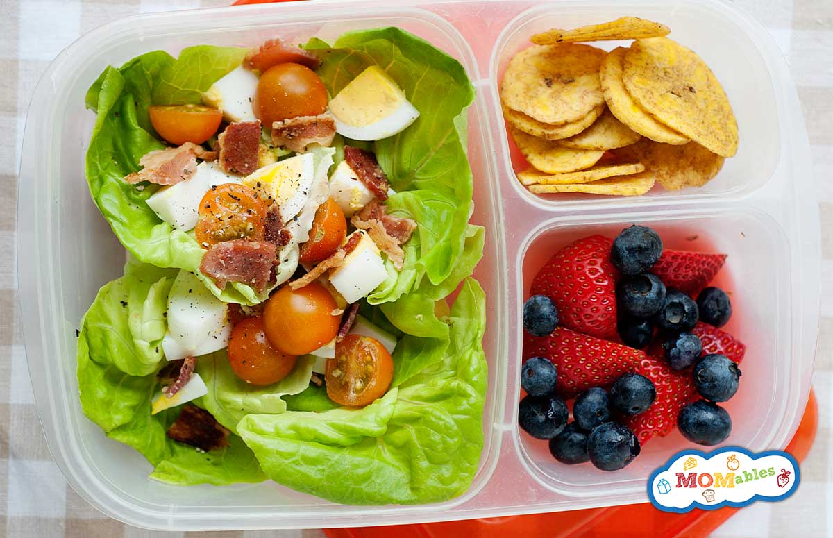 lunch container with a lunch salad and fruit 