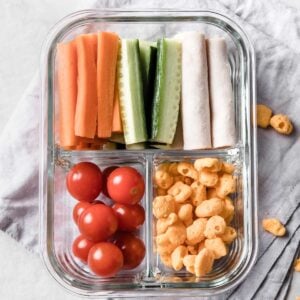a small snack container with turkey, veggies and snacks