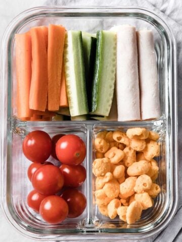 a small snack container with turkey, veggies and snacks