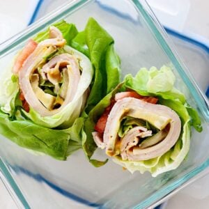turkey avocado lettuce wraps in a glass lunchbox