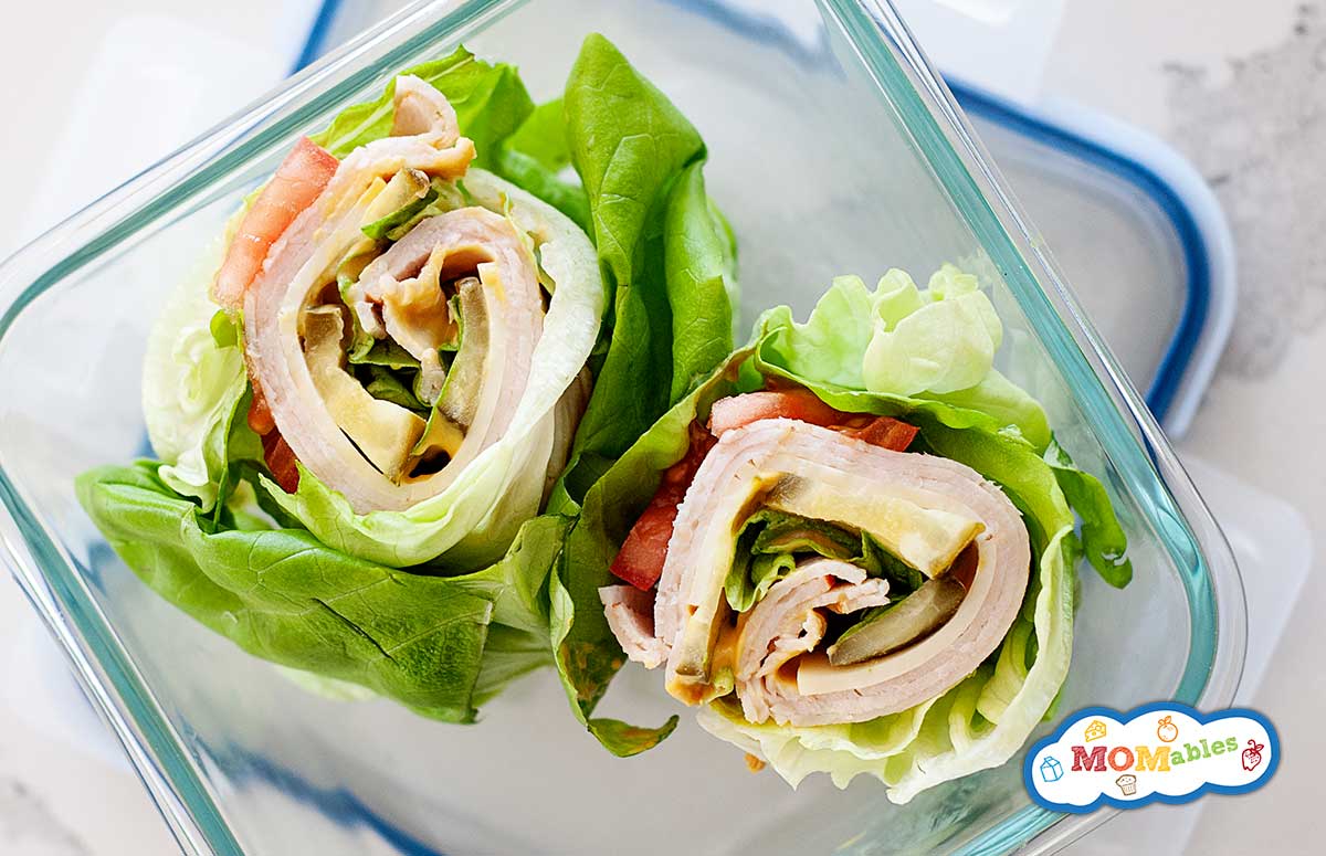two lettuce wraps with turkey and avocado