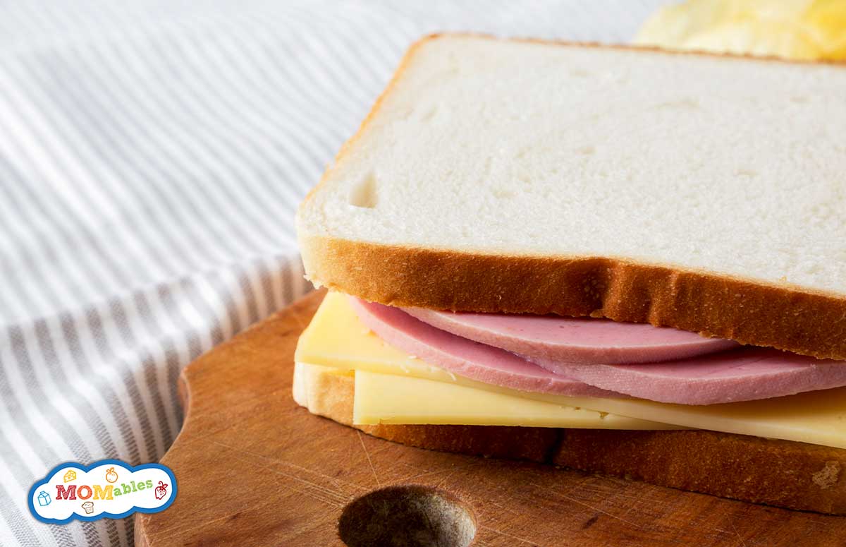 a bologna and swiss sandwich on white bread