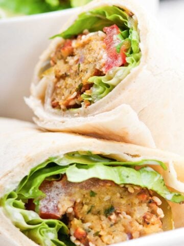 two halves of a falafel tortilla wrap