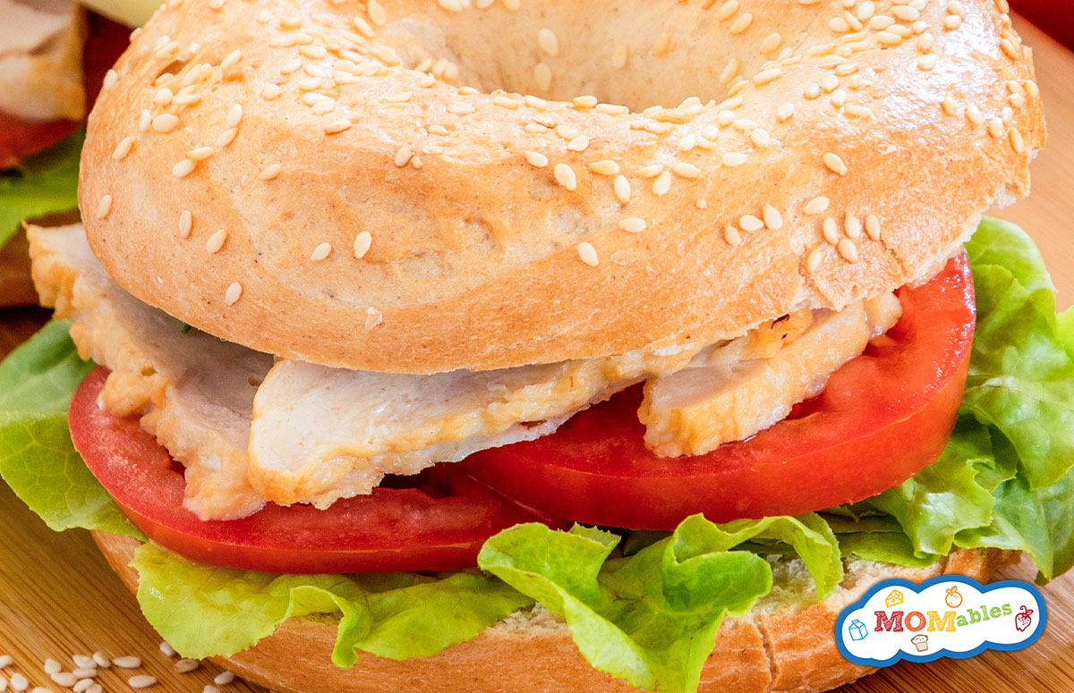 chicken bagel sandwich with lettuce and tomato