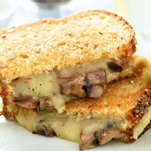 two halves of a mushroom grilled cheese sandwich