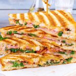 grilled sandwich with ham, cheese tomatoes and spinach