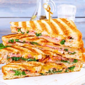 grilled sandwich with ham, cheese tomatoes and spinach