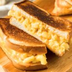 macaroni and cheese grilled cheese sandwich cut in half