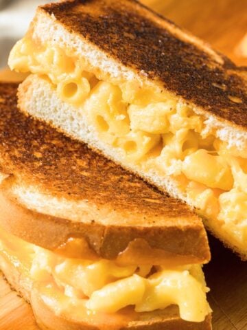 two halves of a macaroni and cheese grilled cheese