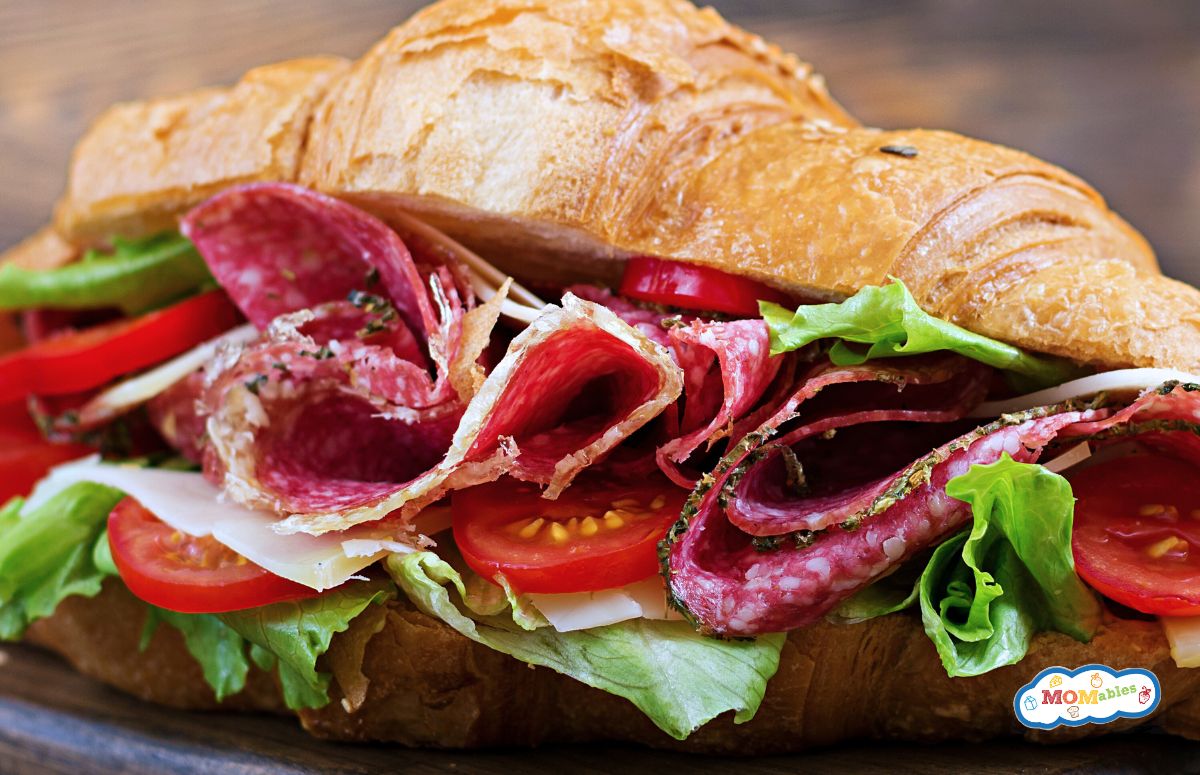 salami croissant with tomatoes and lettuce