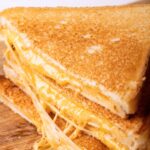 whole wheat grilled cheese halves stacked