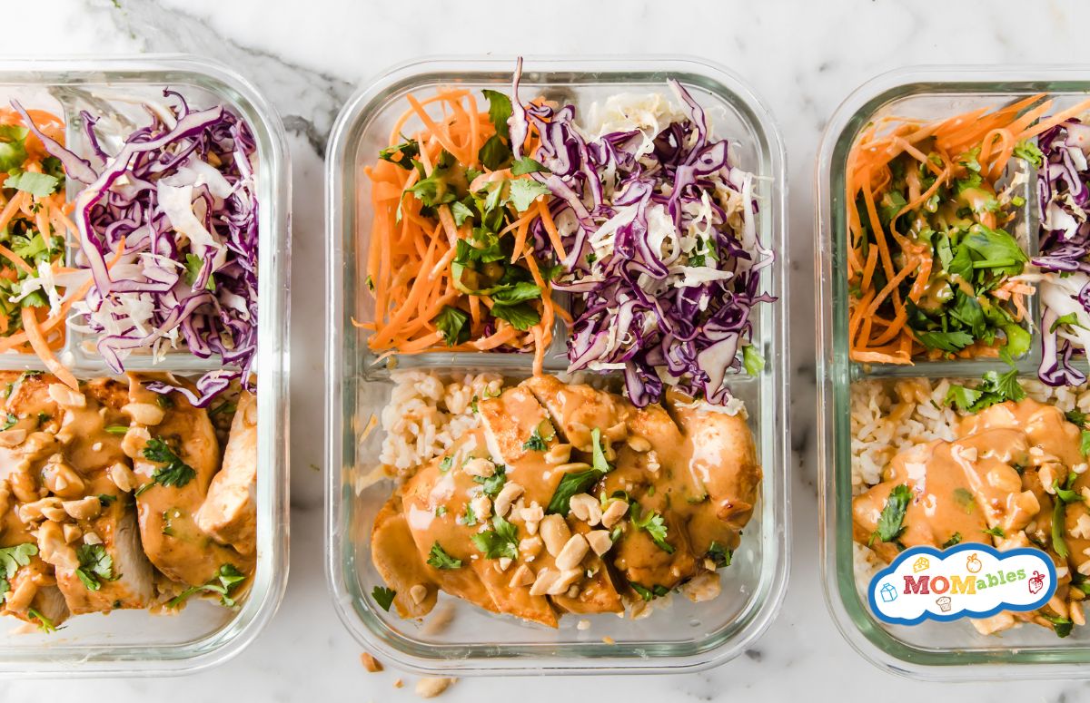 three glass lunch containers with thai chicken and salad in them