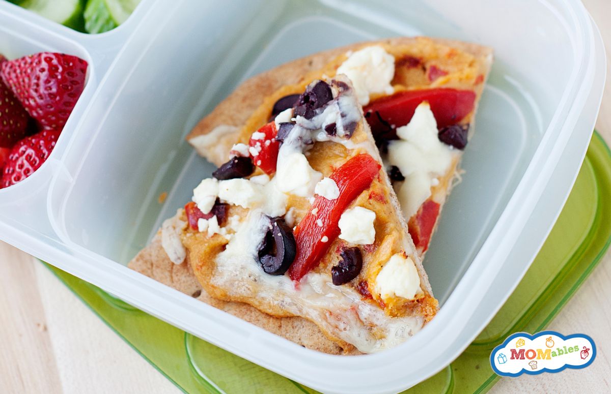 two hummus pita pizza slices