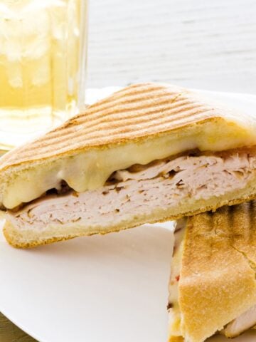two halves of a turkey and cheese panini
