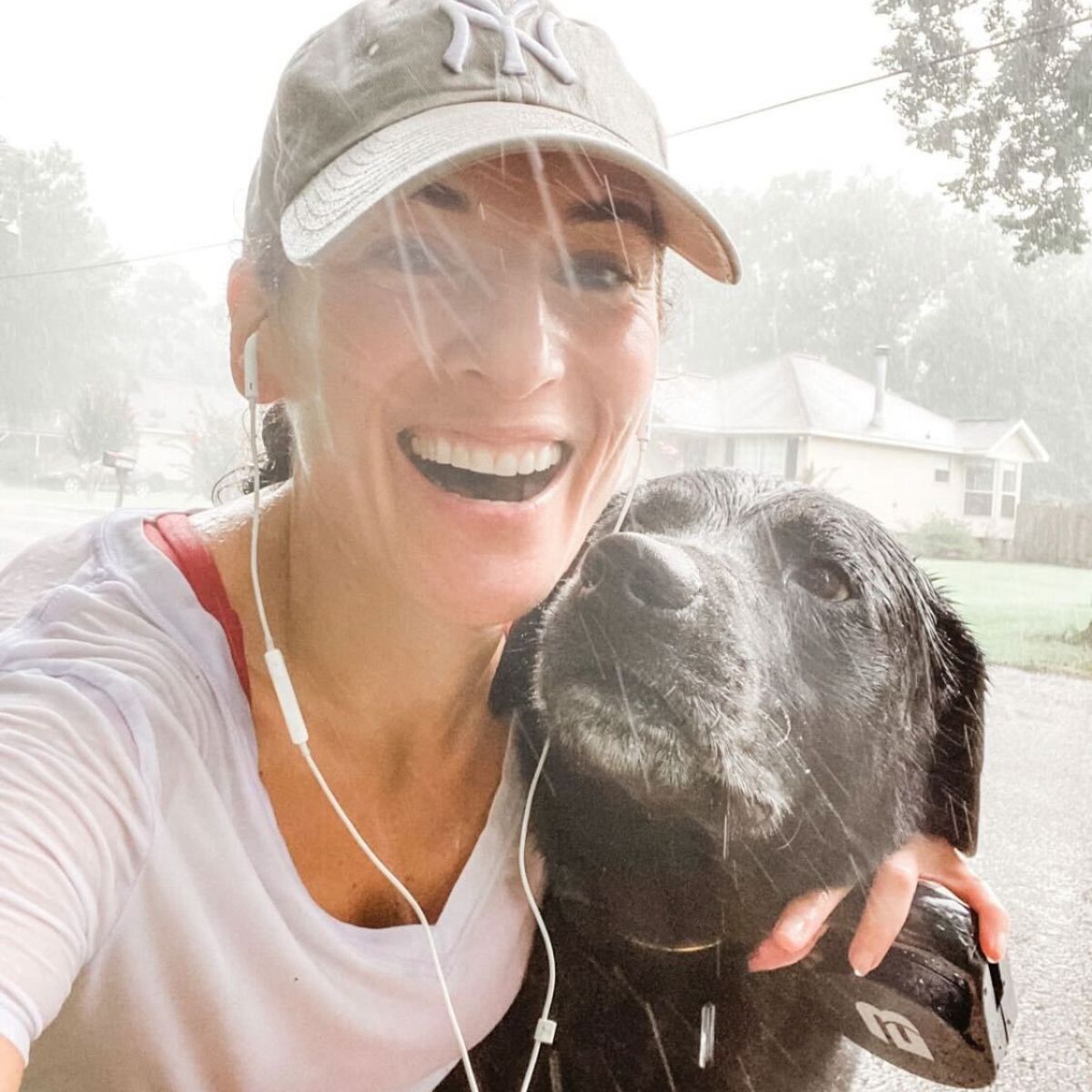 Laura Fuentes on a walk with her black lab lucas
